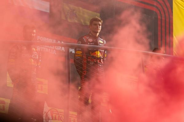 MONZA, ITALY - SEPTEMBER 03: Red Bull Racing driver Max Verstappen (1) of the Netherlands can barely be seen through the Ferrari red smoke after the F1 Italian Grand Prix on Sunday, September 3, 2023 at the Autodromo Nazionale Monza in Monza, Italy. (Photo by Bob Kupbens/Icon Sportswire via Getty Images)
